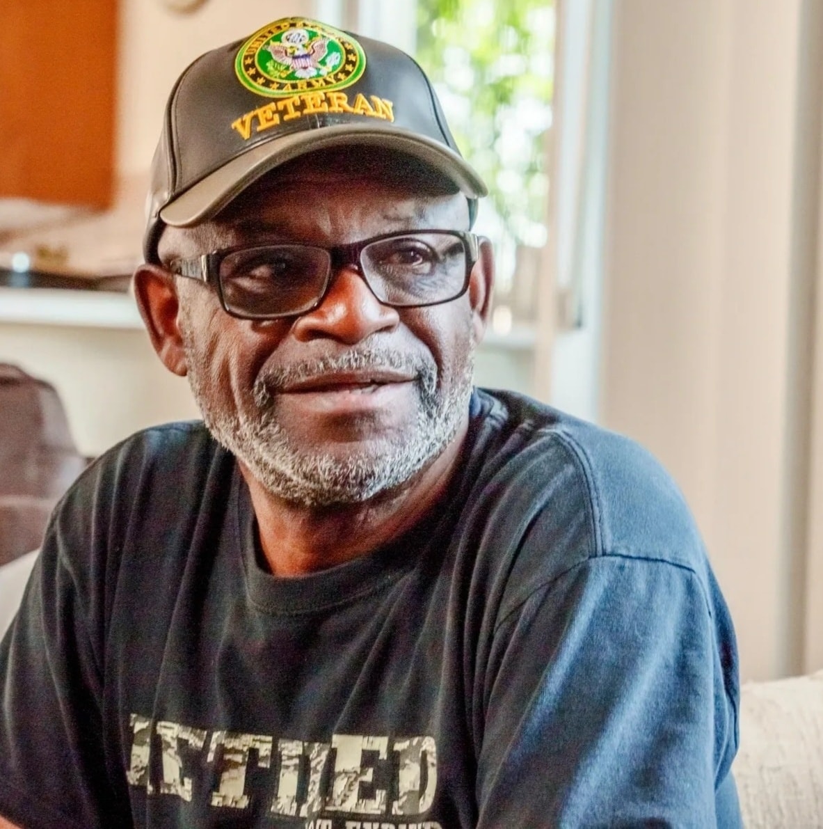 A veteran we serve, smiling with dignity